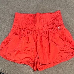 Red Athletic Shorts with Elastic Waistband and Curved Hem